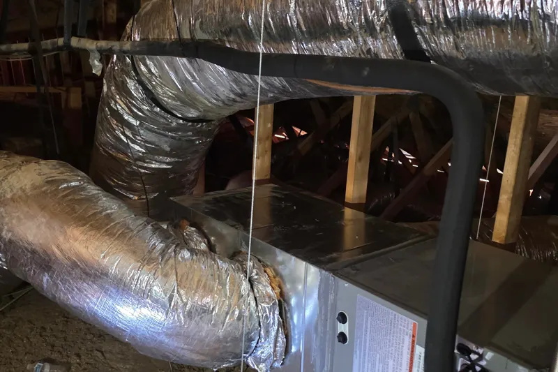 New insulated ductwork connected to an attic air handler