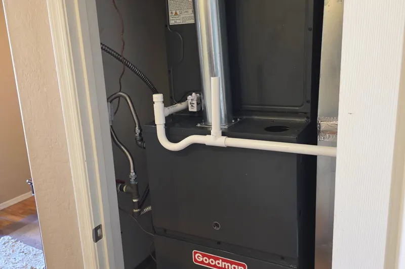 New Goodman gas furnace installed in a hall closet